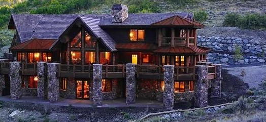 Log home finished with a translucent log and siding stain